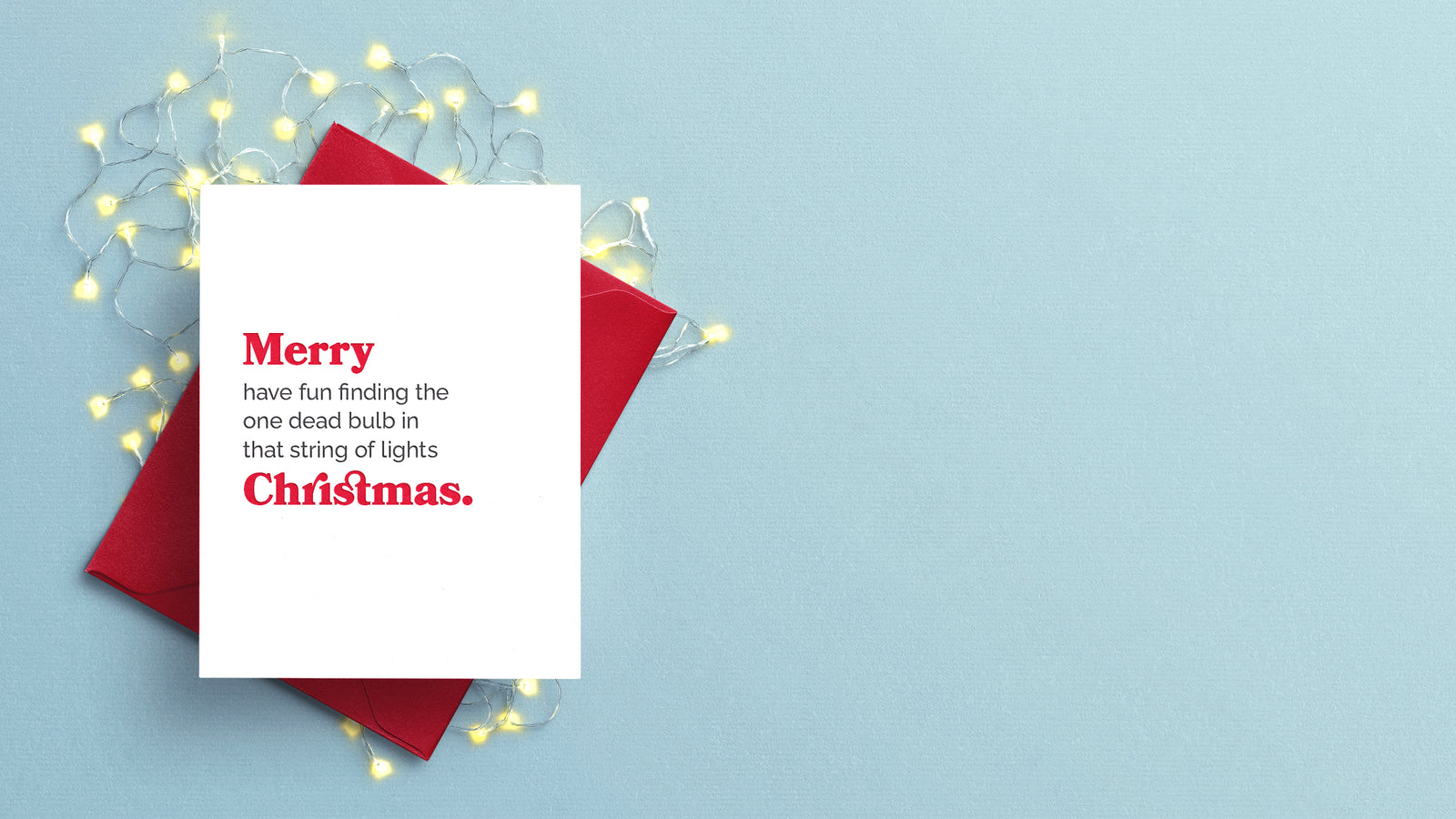 Christmas card with text: Merry have fun finding the one dead bulb in that string of lights Christmas. Letterpress printed red and black text on white paper with red envelope.